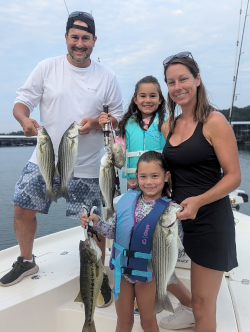 Family has successful fishing trip catching Lake Lanier striped bass