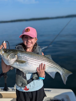 Girl catches great Lake Lanier Striped Bass