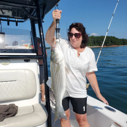 Lady catches Lake Lanier Striper